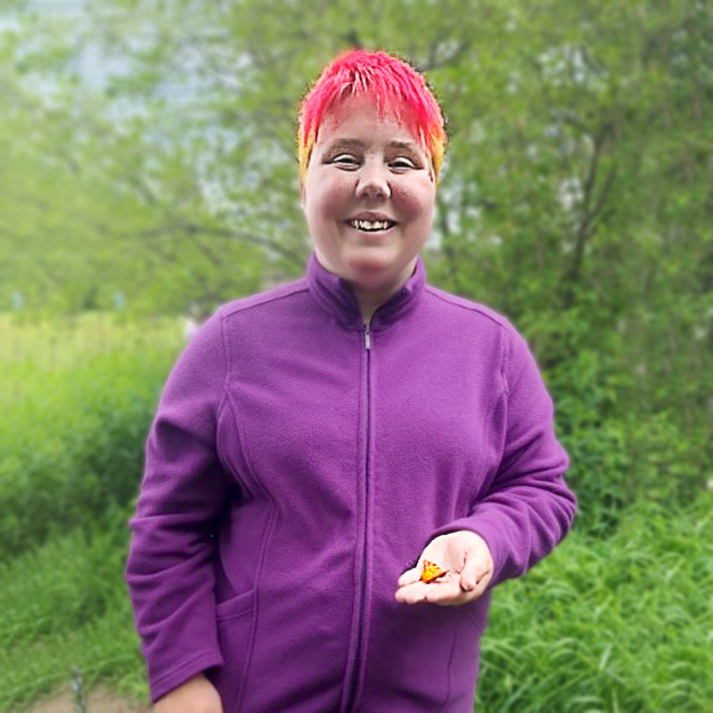 Farm-to-table-48 woman with bright hair holding butterfly